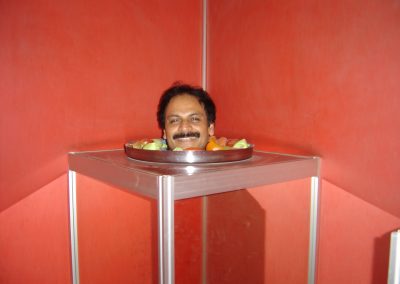 Optical illusion exhibit at the Science Museum in Bangalore during his Fulbright Scholarship tenure in India (2005)
