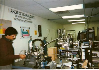 Professor Misra adjusting the gas flow for chemical kinetics experiments