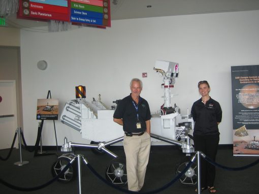 Dave Martin and Diane Pugel posing with the Curiosity rover model.