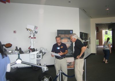 Eric Lyness and Dave Martin reviewing the rover schematics