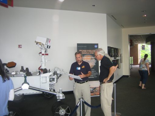 Eric Lyness and Dave Martin reviewing the rover schematics