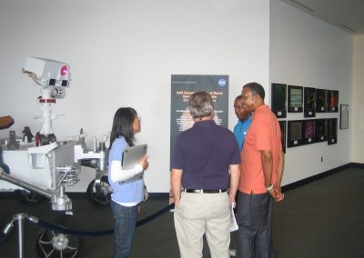 Florence Tan and Eric Lyness conversing with exhibition attendees